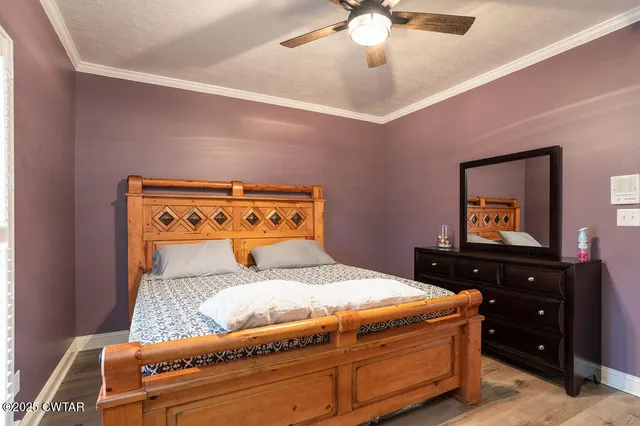 a view of a room with a ceiling fan