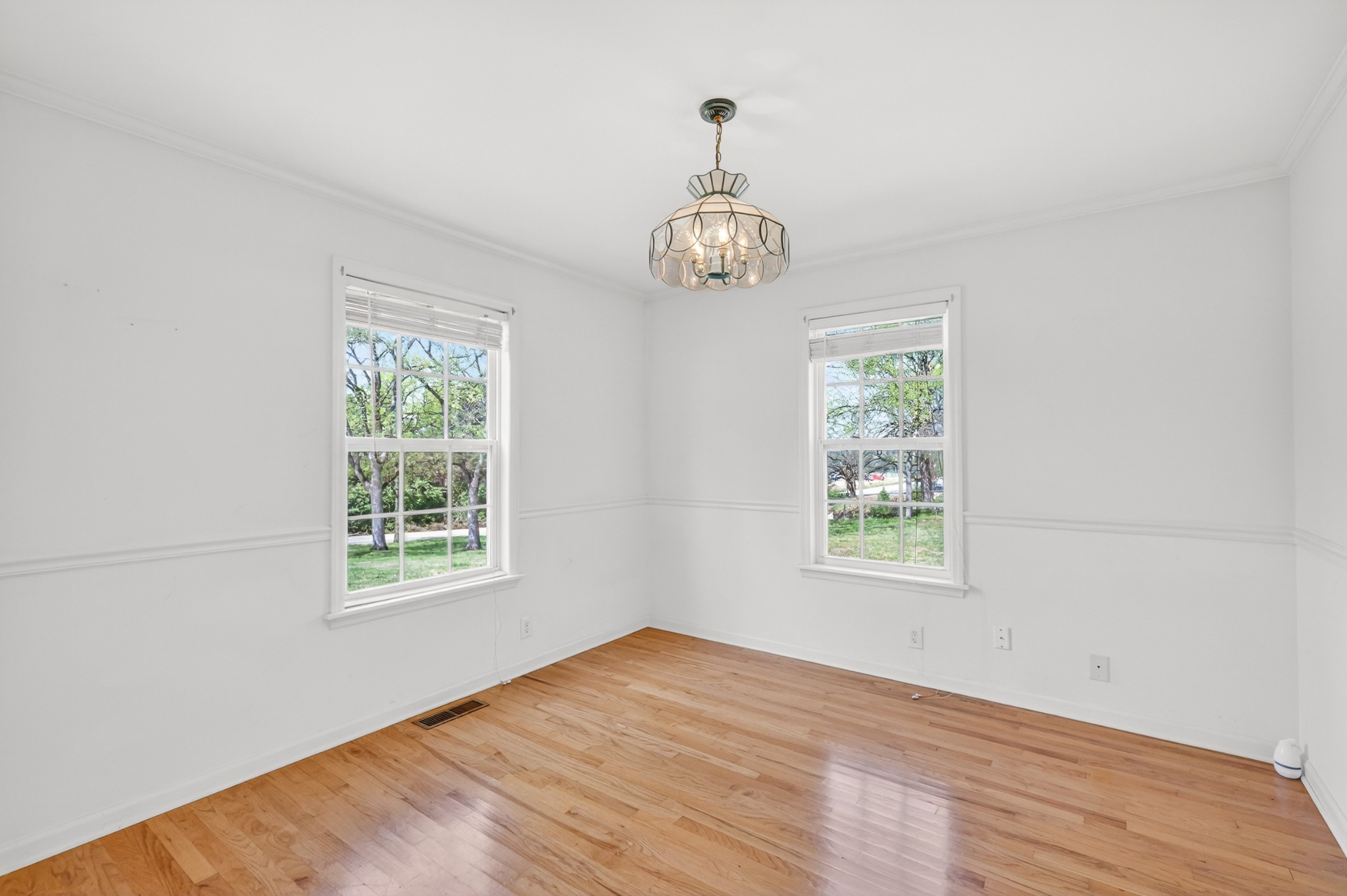 3258 Boyd Mill Avenue Franklin, TN 37064 - Photo 11 of 35 a view of an empty room with wooden floor and a window