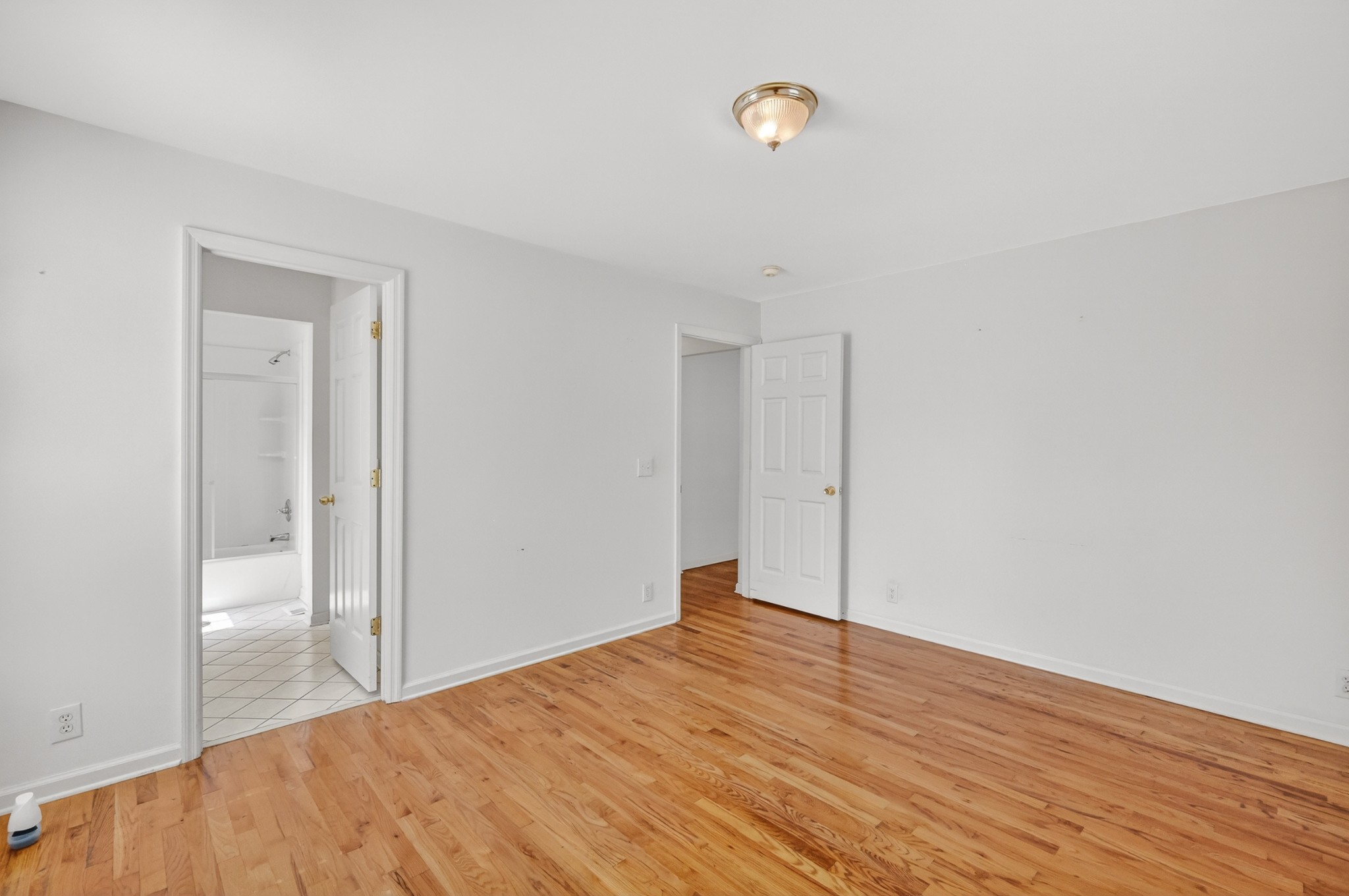 3258 Boyd Mill Avenue Franklin, TN 37064 - Photo 25 of 35 a view of an empty room with wooden floor and a window