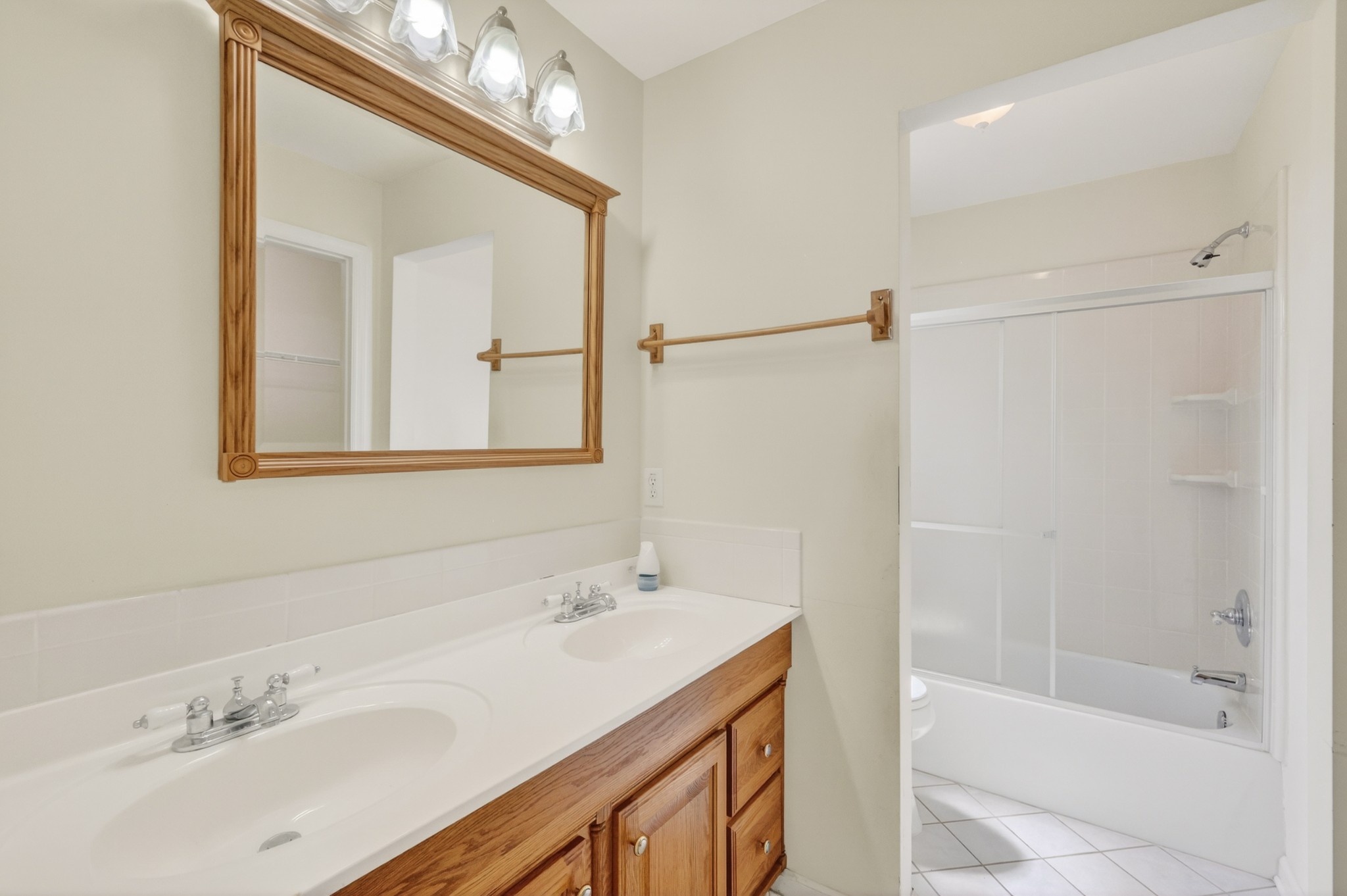3258 Boyd Mill Avenue Franklin, TN 37064 - Photo 26 of 35 a bathroom with a bathtub shower sink vanity and mirror
