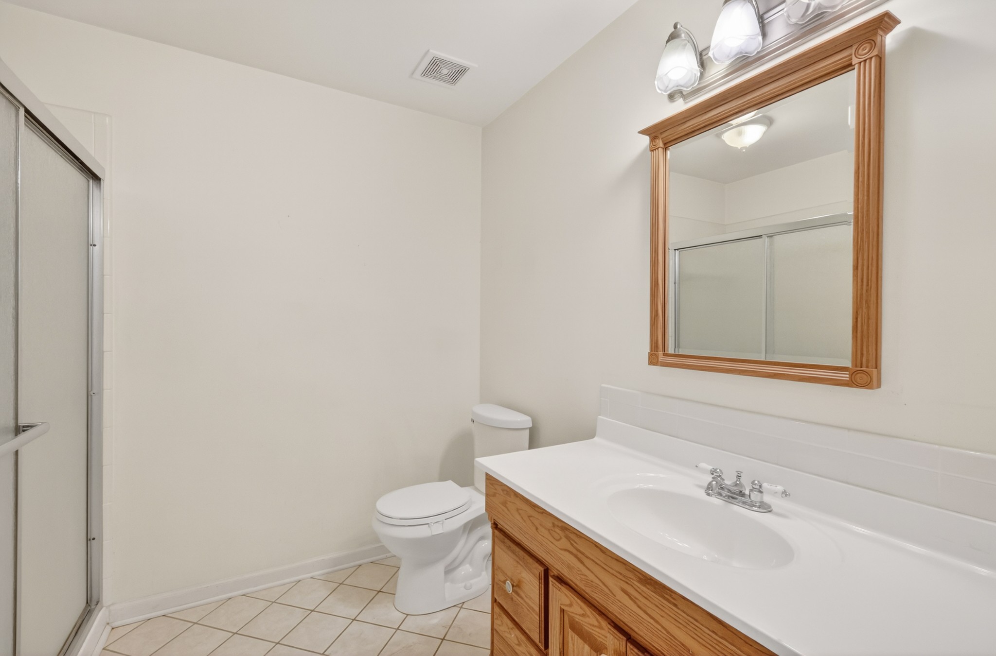 3258 Boyd Mill Avenue Franklin, TN 37064 - Photo 27 of 35 a bathroom with a sink a toilet and mirror