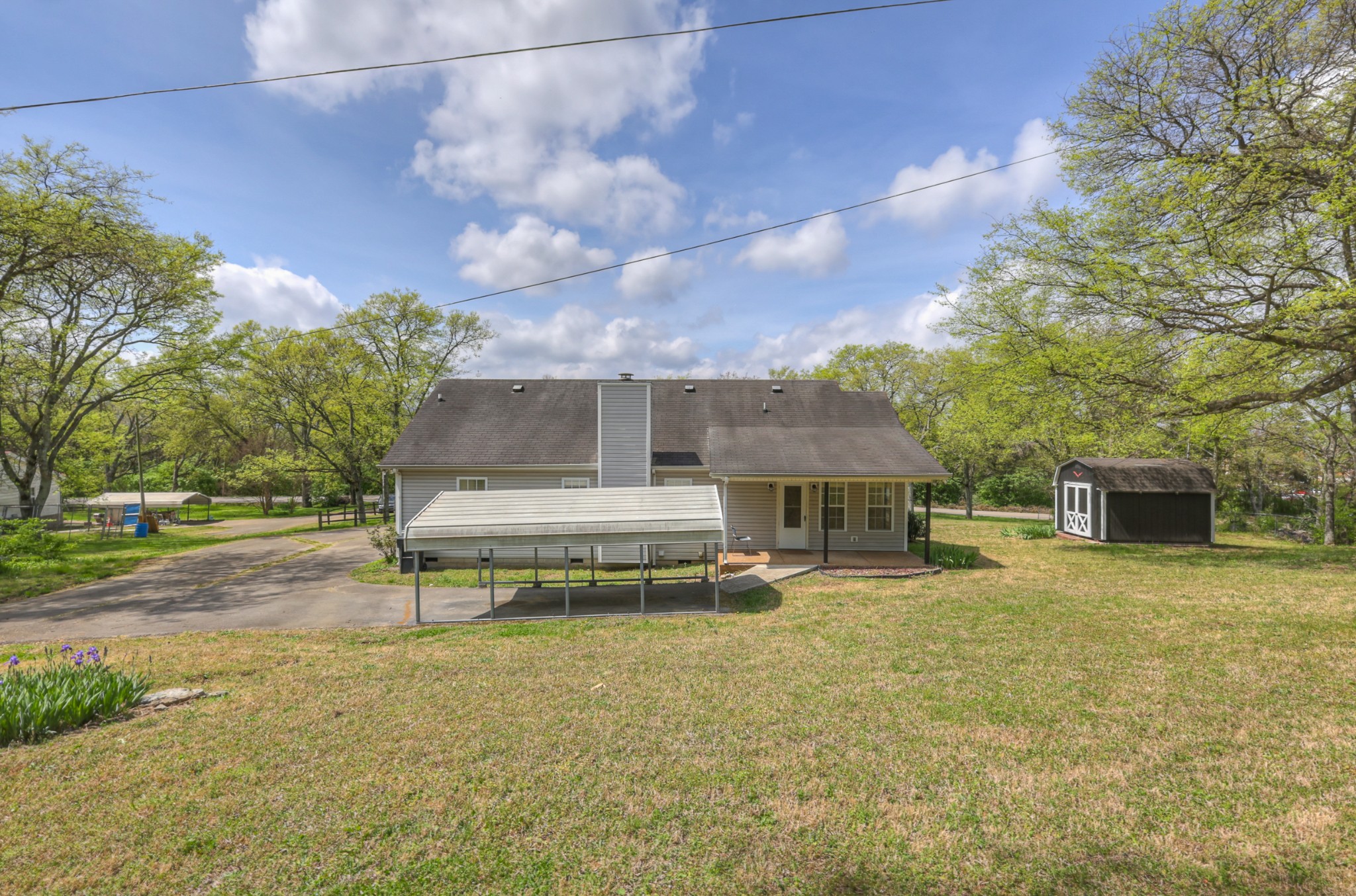 3258 Boyd Mill Avenue Franklin, TN 37064 - Photo 31 of 35 a view of a house with a yard and sitting area