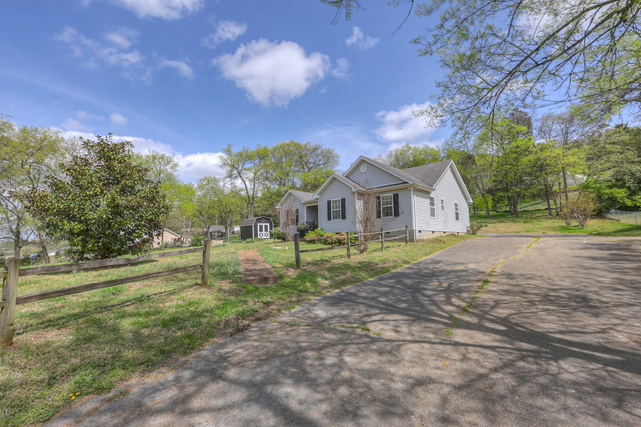 3258 Boyd Mill Avenue Franklin, TN 37064 - Photo 34 of 35 a front view of a house with a yard