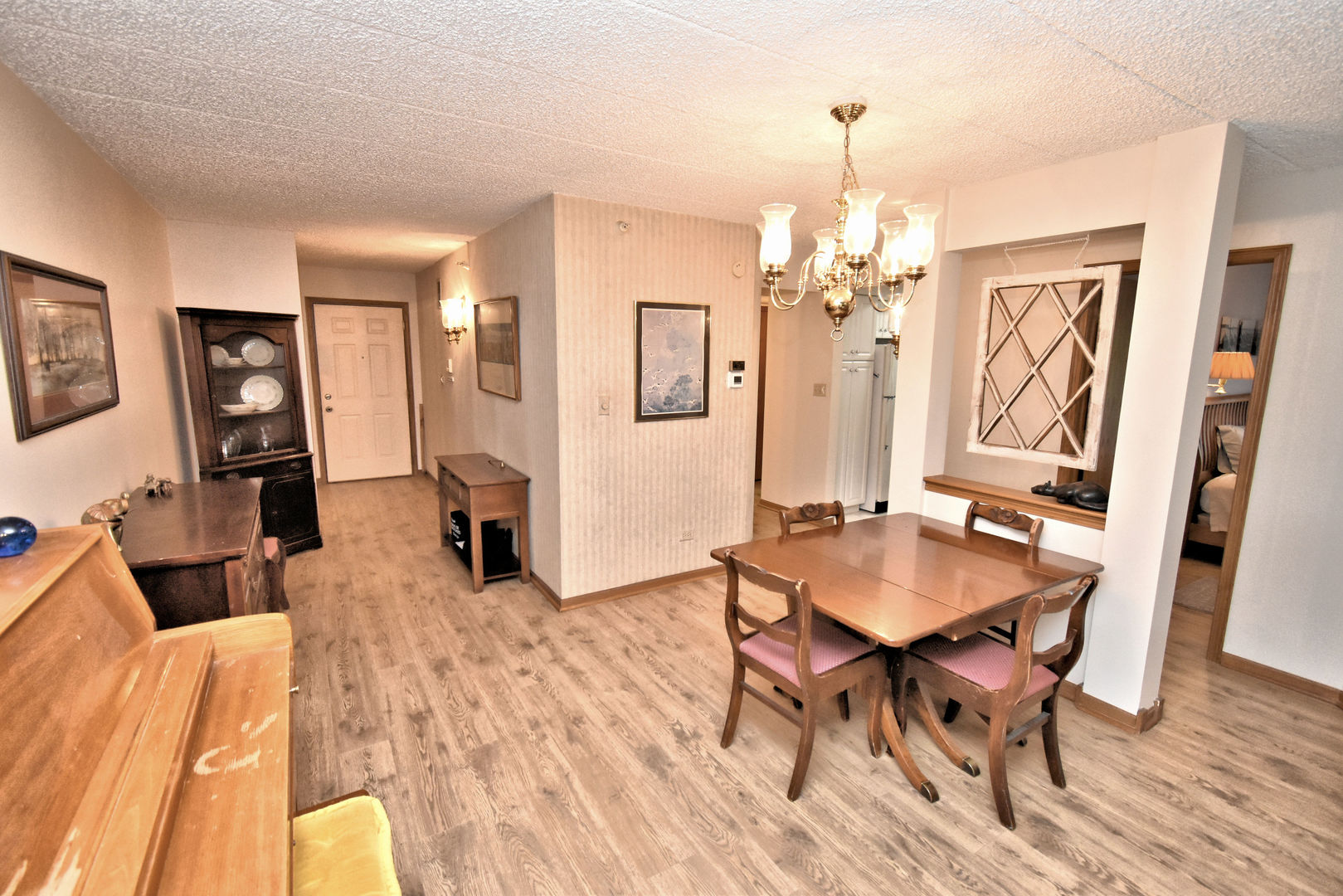 3620 186th Street, Unit 101 Lansing, IL 60438 - Photo 11 of 26 a dining room with wooden floor and furniture