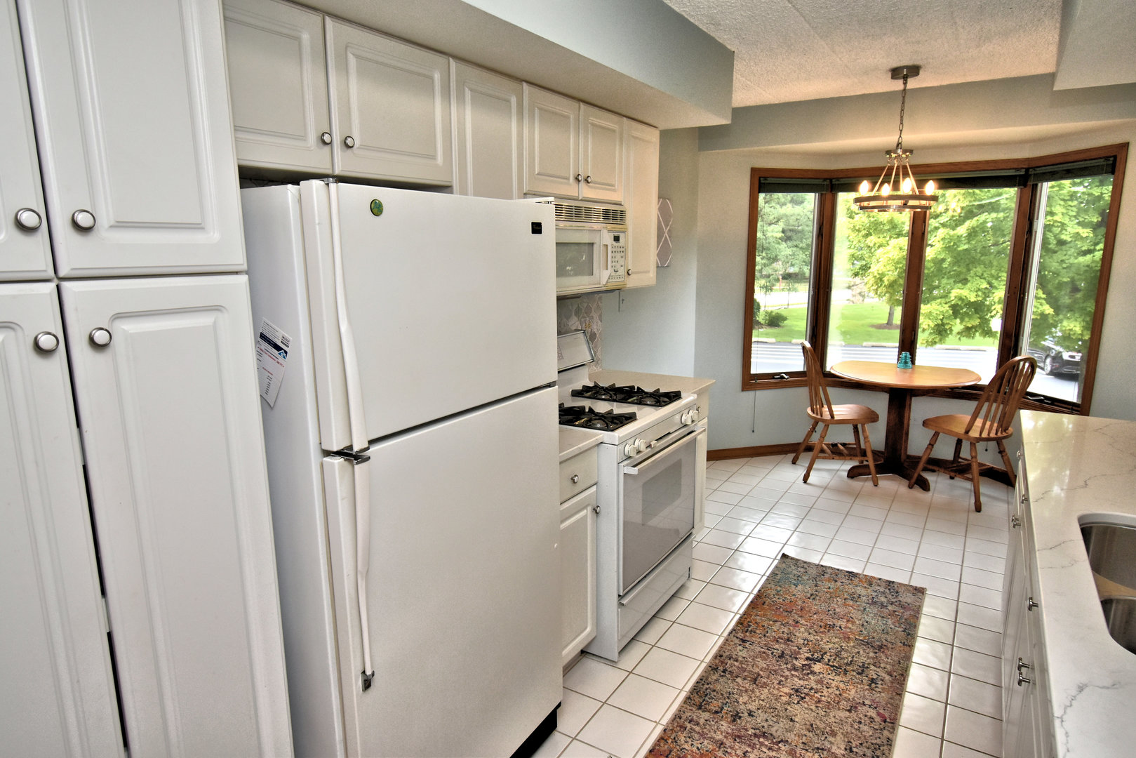 3620 186th Street, Unit 101 Lansing, IL 60438 - Photo 13 of 26 a white refrigerator freezer sitting in a kitchen