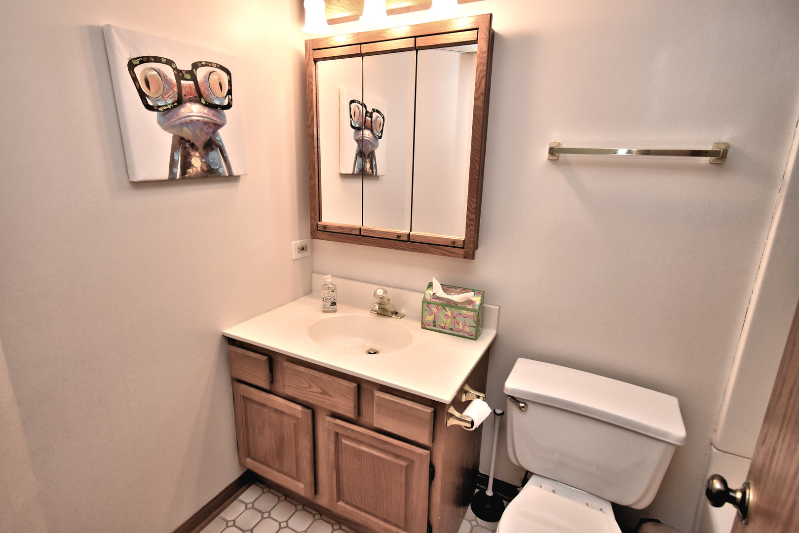 3620 186th Street, Unit 101 Lansing, IL 60438 - Photo 17 of 26 a bathroom with a sink and mirror