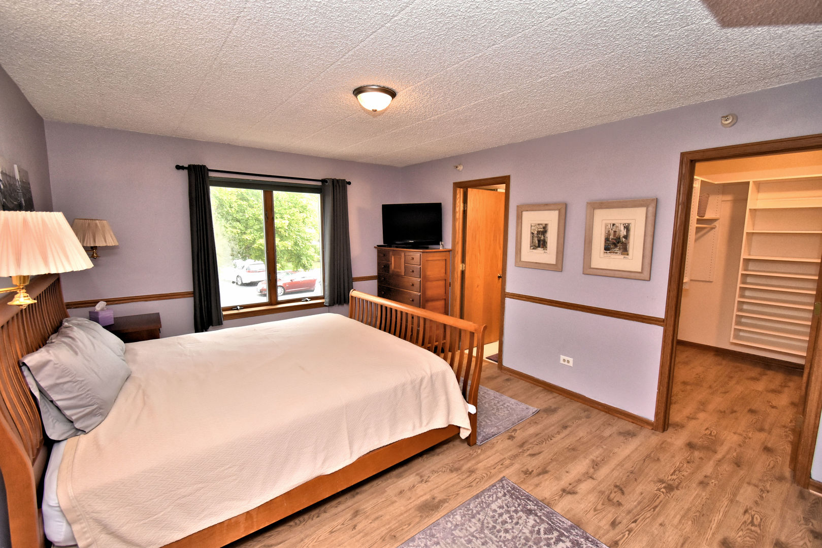 3620 186th Street, Unit 101 Lansing, IL 60438 - Photo 20 of 26 a bedroom with a bed and a window