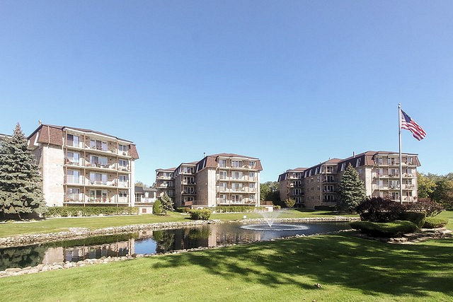 3620 186th Street, Unit 101 Lansing, IL 60438 - Photo 2 of 26 a view of an ocean with a building in the background