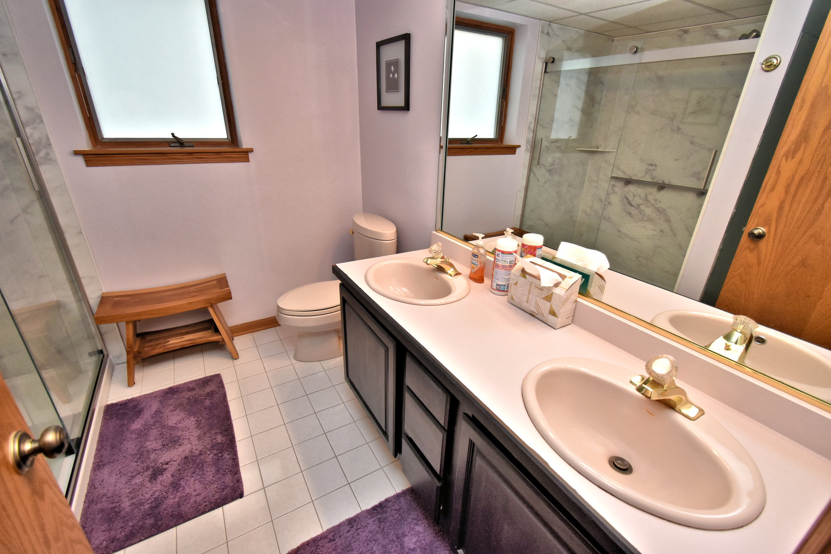 3620 186th Street, Unit 101 Lansing, IL 60438 - Photo 23 of 26 a bathroom with a sink and a mirror
