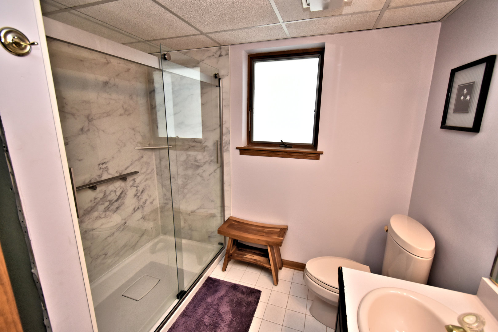 3620 186th Street, Unit 101 Lansing, IL 60438 - Photo 24 of 26 a bathroom with a toilet and a shower