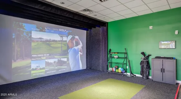 a room with pool table and windows