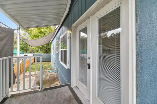 a view of porch with a sink and glass door