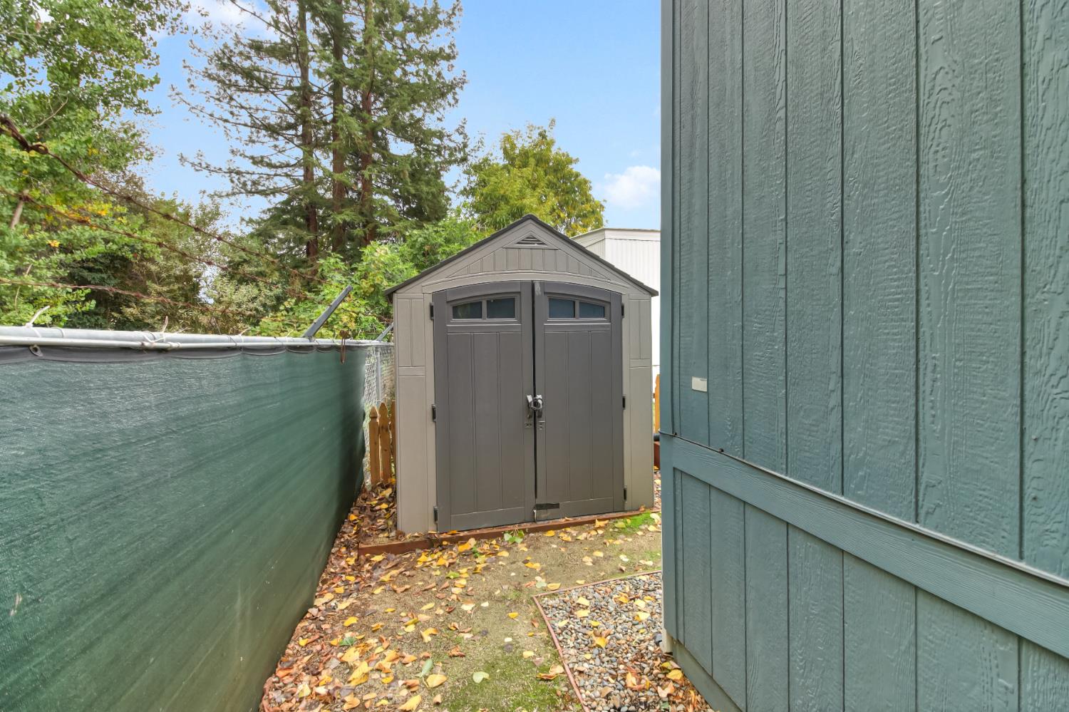 9060 Auburn Folsom Road, Unit 7 Granite Bay, CA 95746 - Photo 17 of 22 a front view of a house with a yard