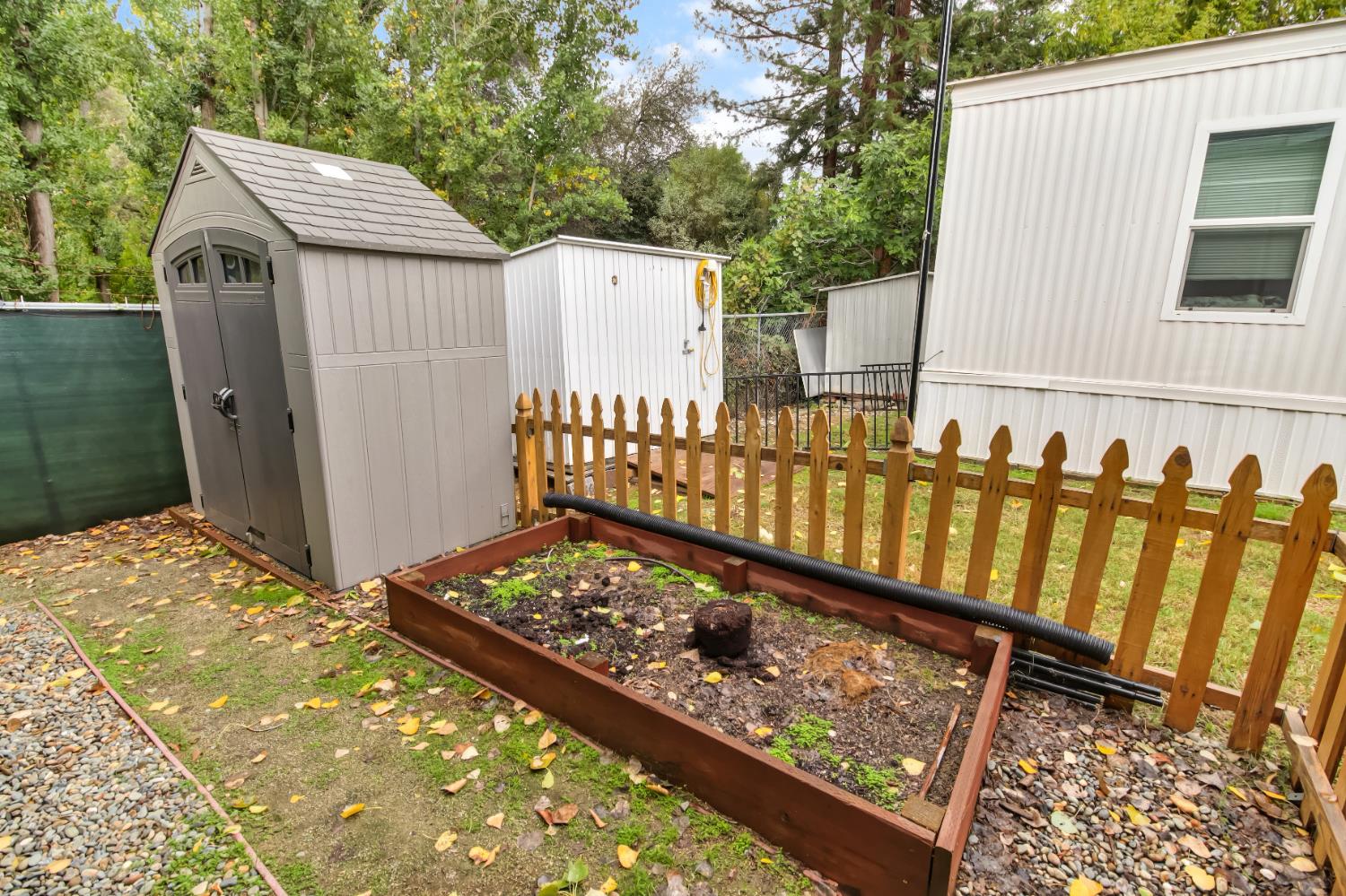 9060 Auburn Folsom Road, Unit 7 Granite Bay, CA 95746 - Photo 18 of 22 a view of a backyard with wooden fence