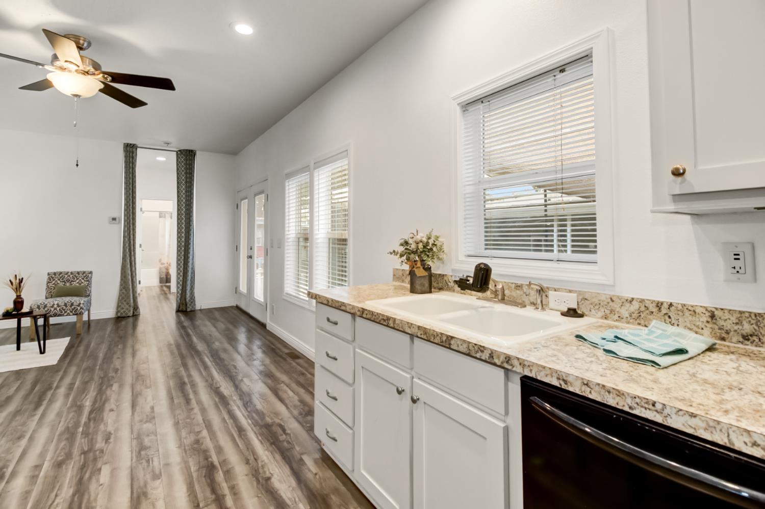 9060 Auburn Folsom Road, Unit 7 Granite Bay, CA 95746 - Photo 6 of 22 a spacious bathroom with a granite countertop sink and a mirror