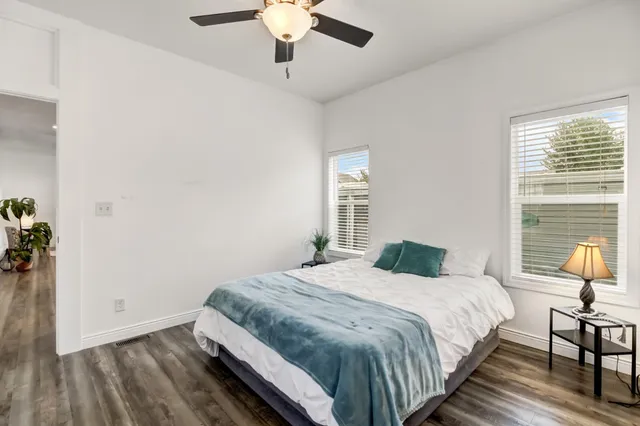 a bedroom with a bed and a chandelier