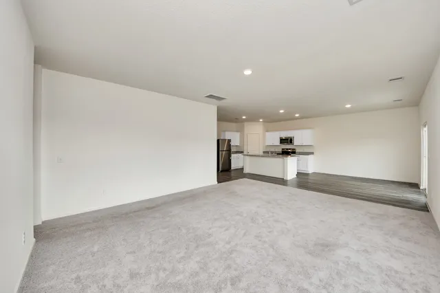 a view of a kitchen with a sink and cabinets