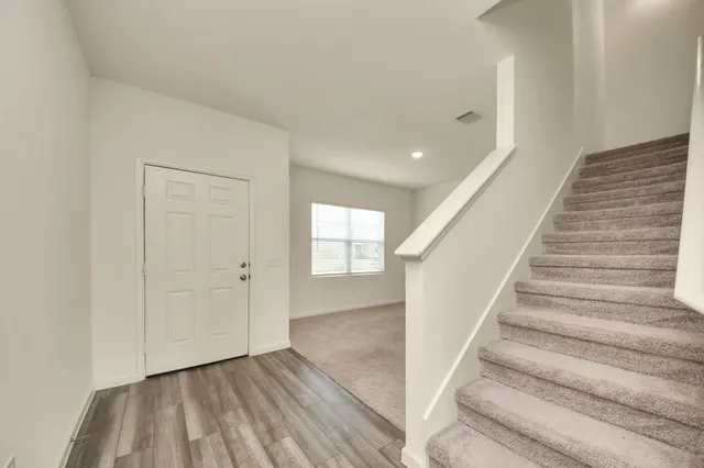 a view of entryway with wooden floor