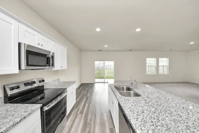 a kitchen with a stove and a sink