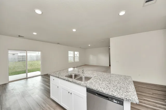 a kitchen with sink and window