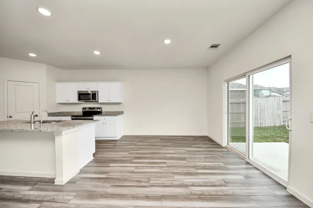 a view of kitchen with sink and microwave