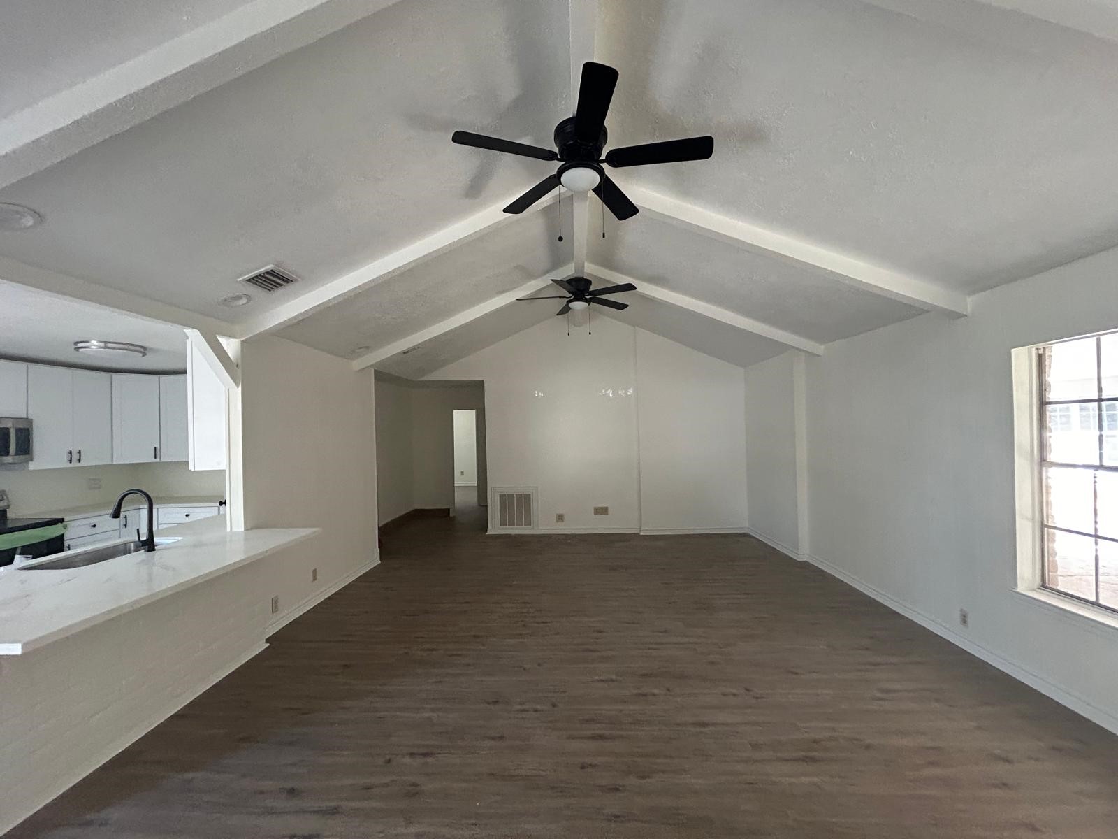 23026 Cranberry Trail Spring, TX 77373 - Photo 1 of 15 a view of an empty room and window ceiling fan
