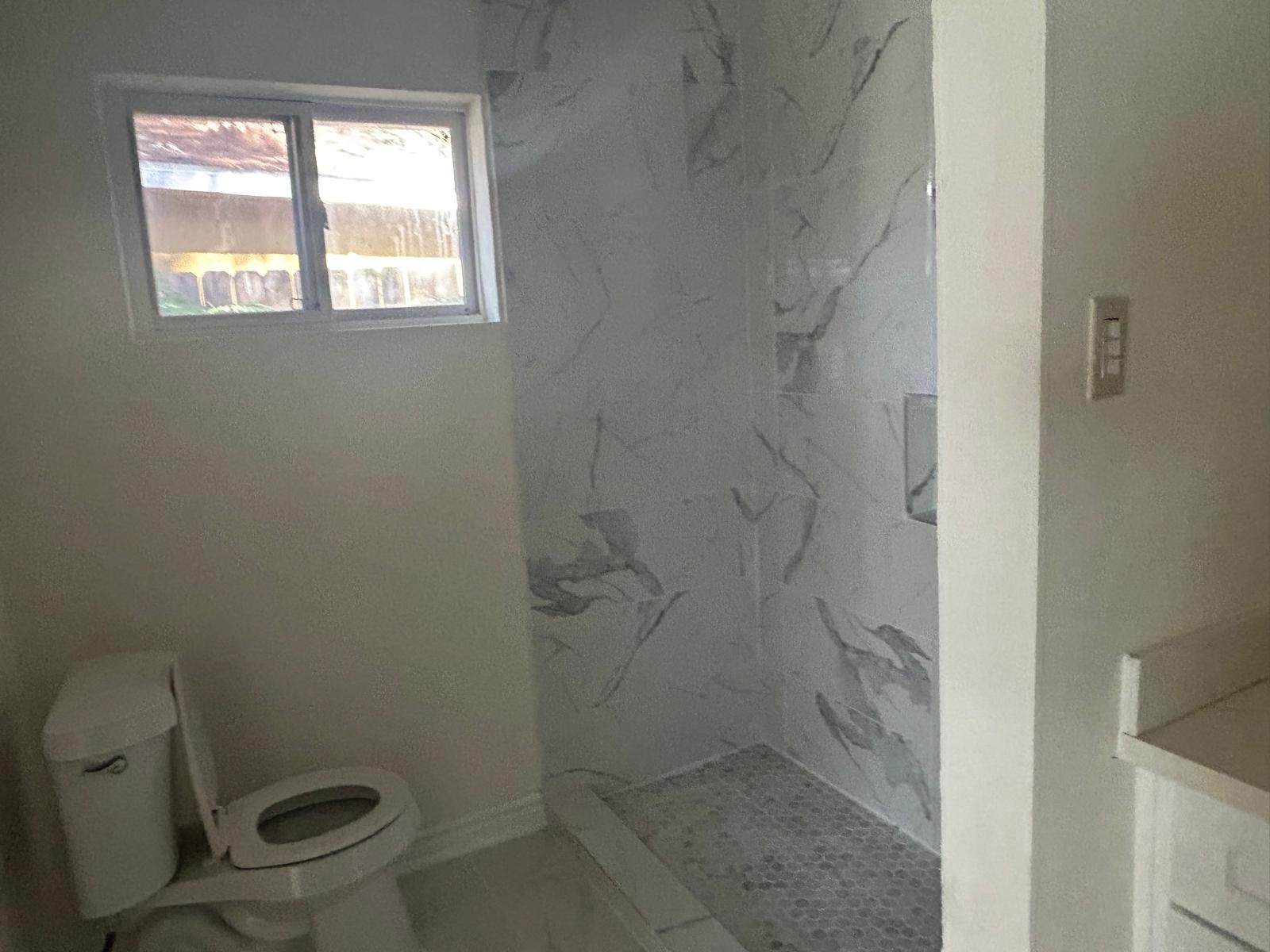 23026 Cranberry Trail Spring, TX 77373 - Photo 13 of 15 a bathroom with a toilet and a shower