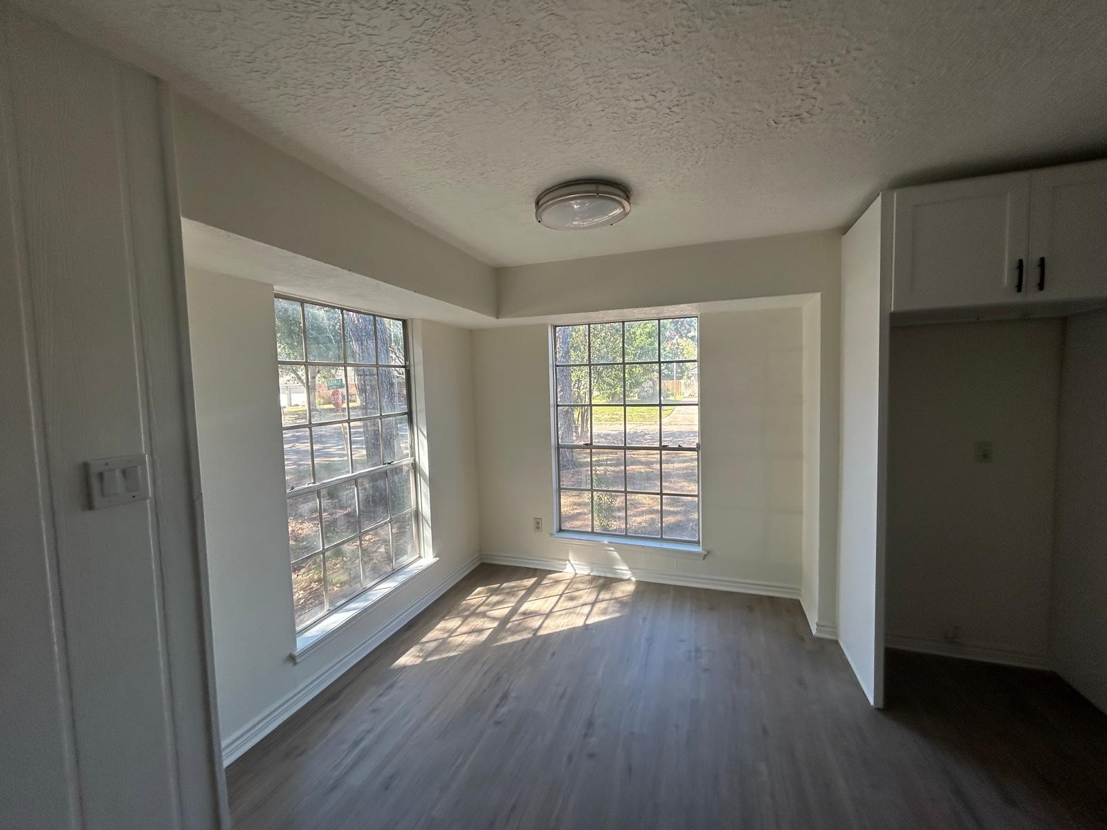 23026 Cranberry Trail Spring, TX 77373 - Photo 5 of 15 an empty room with wooden floor and windows