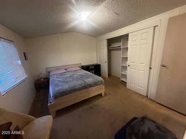 2121 North Center Street, Unit 120 Mesa, AZ 85201 - Photo 16 of 34 a bedroom with a bed and a refrigerator