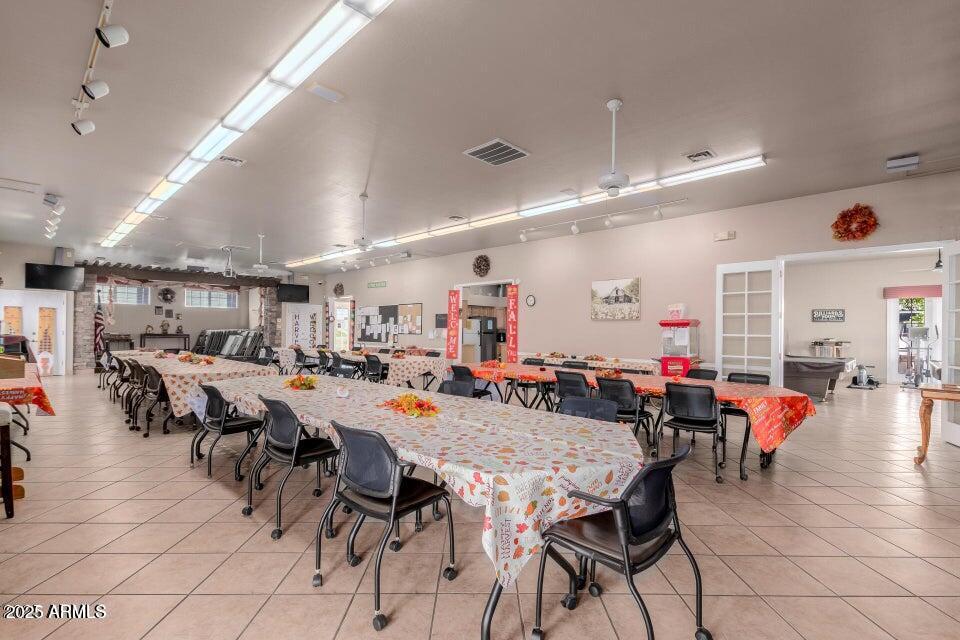 2121 North Center Street, Unit 120 Mesa, AZ 85201 - Photo 27 of 34 a view of a dining area with furniture and a kitchen