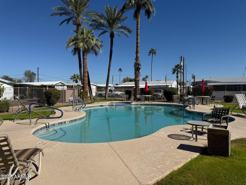 2121 North Center Street, Unit 120 Mesa, AZ 85201 - Photo 32 of 34 a view of a backyard with potted plants