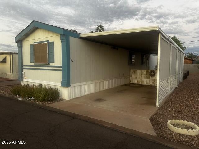 2121 North Center Street, Unit 120 Mesa, AZ 85201 - Photo 9 of 34 a view of a house with a garage