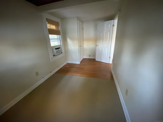 a view of an empty room and window