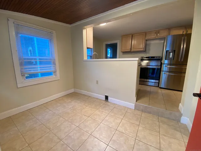 a view of a kitchen with microwave and cabinets