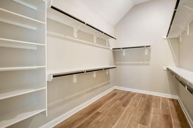 a bedroom with a bed and a lamp