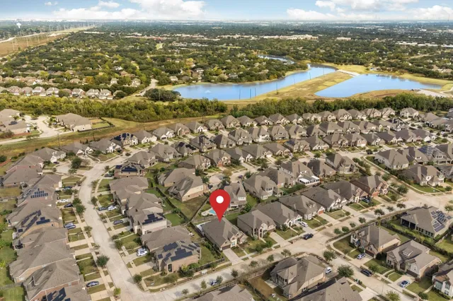 an aerial view of residential building and ocean