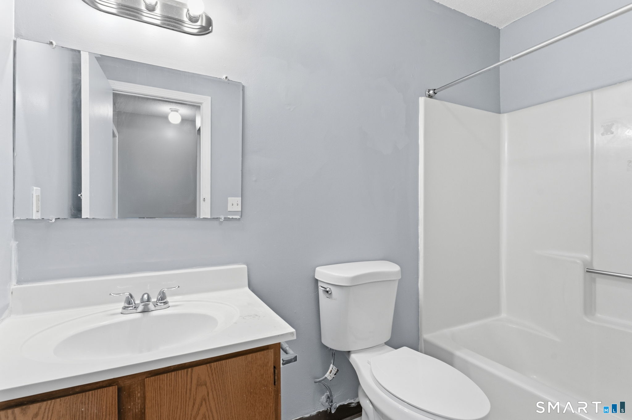 5-7 Warner St Extension, Unit 5B Hartford, CT 06114 - Photo 13 of 17 a bathroom with a sink toilet and shower