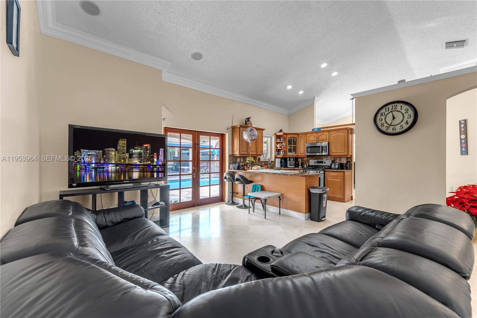 14920 Southwest 151st Terrace Miami, FL 33196 - Photo 13 of 27 a living room with furniture and a wooden floor
