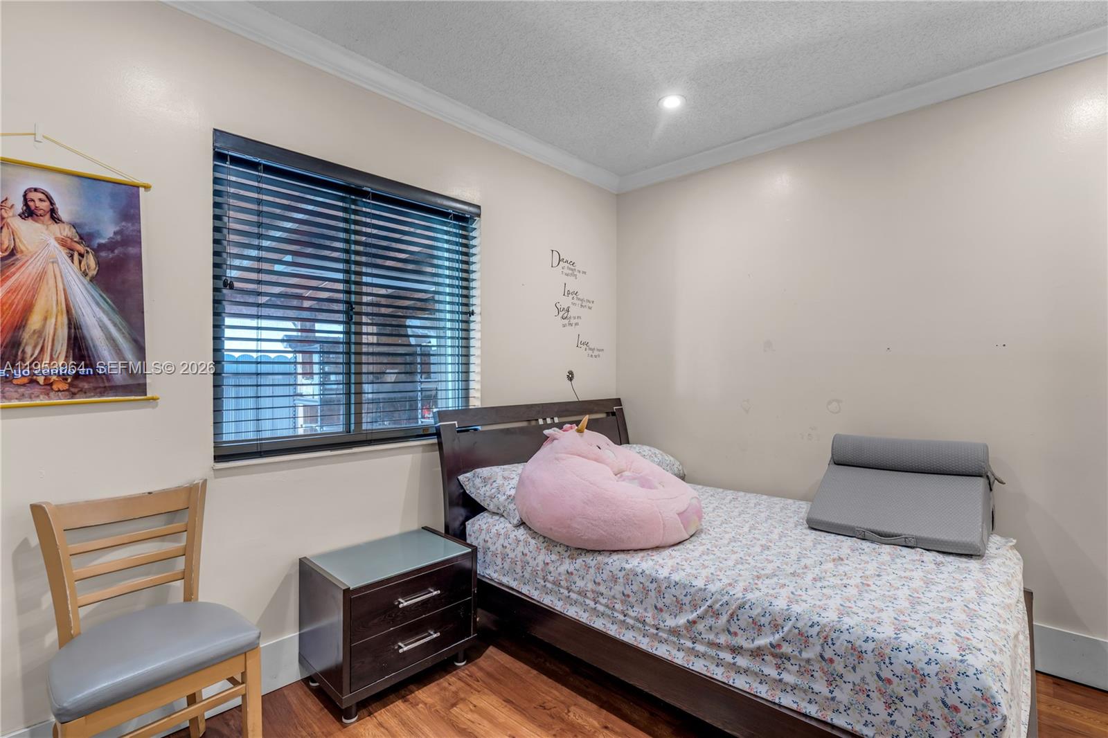 14920 Southwest 151st Terrace Miami, FL 33196 - Photo 17 of 27 a bedroom with a bed and a window