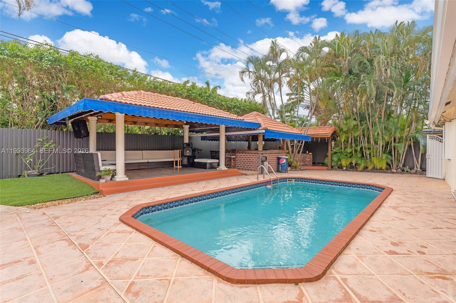 14920 Southwest 151st Terrace Miami, FL 33196 - Photo 6 of 27 swimming pool view with a seating space