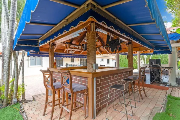 a view of a chairs and table in the patio