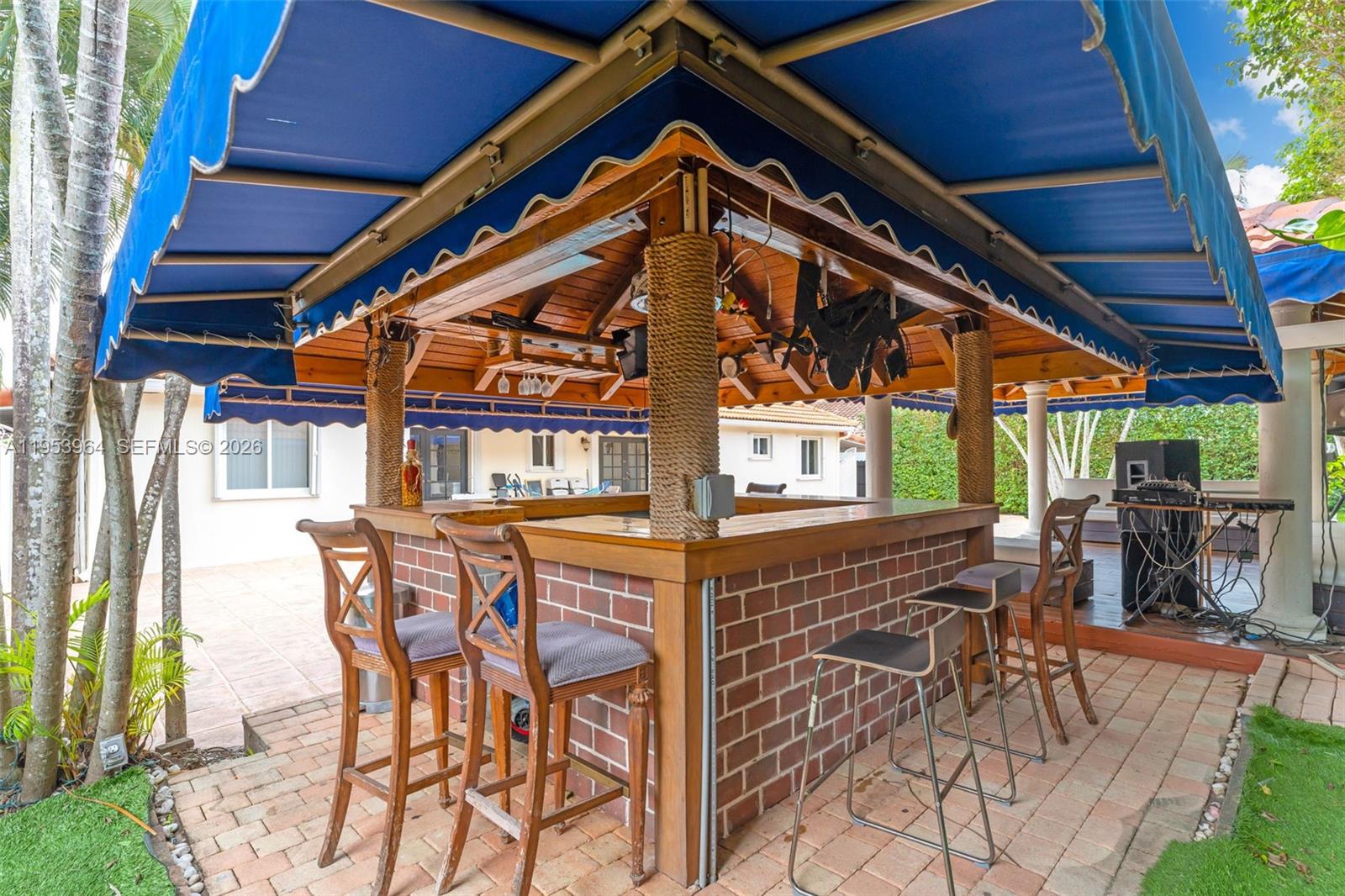 14920 Southwest 151st Terrace Miami, FL 33196 - Photo 8 of 27 a view of a chairs and table in the patio