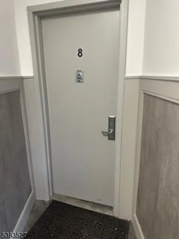 a bathroom with a sink toilet and window