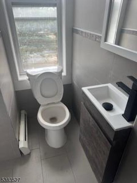 104 President Street, Unit 8 Passaic, NJ 07055 - Photo 8 of 8 a bathroom with a sink toilet and window