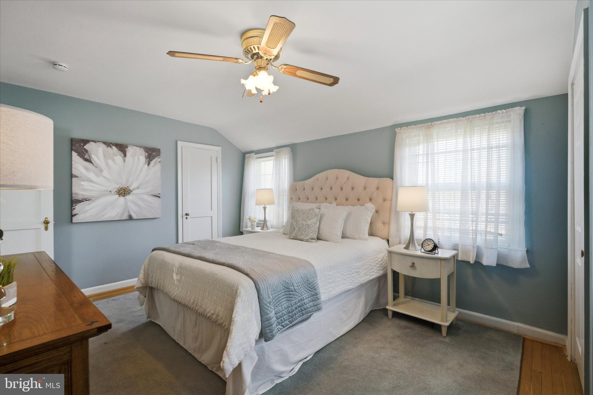 1612 Colony Lane Havertown, PA 19083 - Photo 19 of 34 a bedroom with a bed and a chandelier