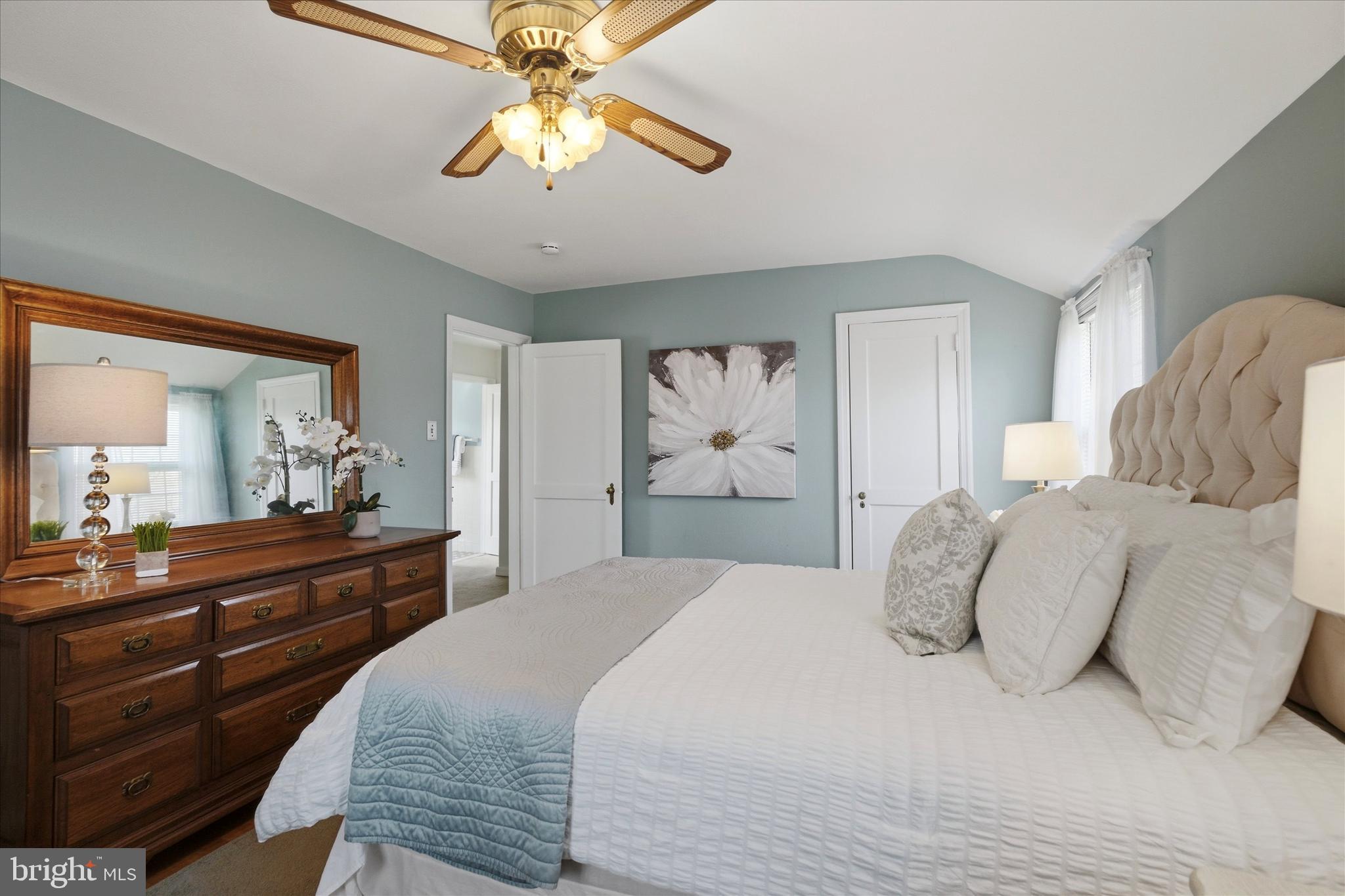 1612 Colony Lane Havertown, PA 19083 - Photo 20 of 34 a bedroom with a bed and a chandelier