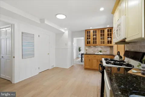 a kitchen that has a sink and a stove in it