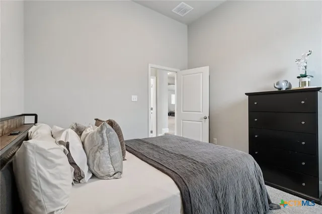 a bathroom with double sink and a mirror