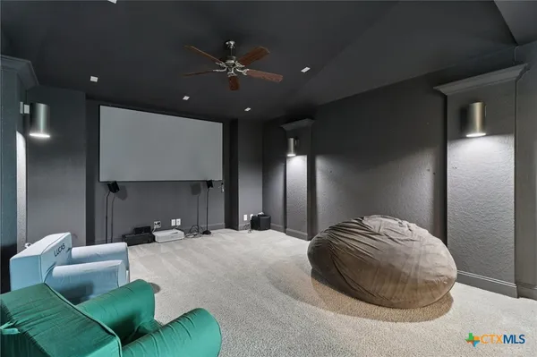a bedroom with bed and a chandelier