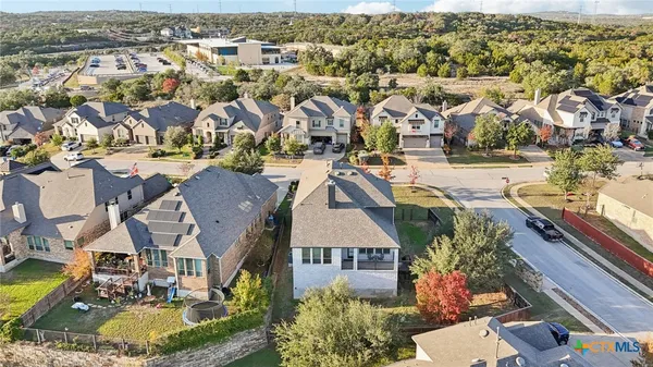 an aerial view of residential houses with outdoor space